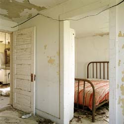 WENDY BURTON - Interior, Red Bedspread, Fortuna, North Dakota, photograph