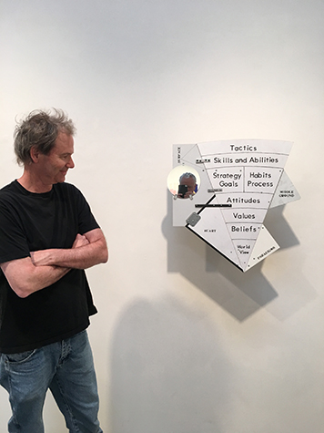 Artist Greg Colson and his piece, Onion Model of Personal Growth, installed in his exhibition, Model of Integrity, 2017