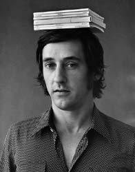 JERRY MCMILLAN - Ed Ruscha with six of his books on his head